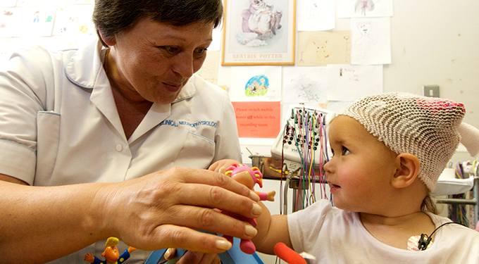 Staff member playing with child